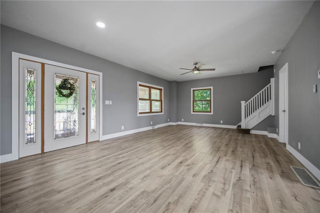 736 Shenango Road New Castle, PA 16101 - Photo 20 of 41 an empty room with wooden floor and windows