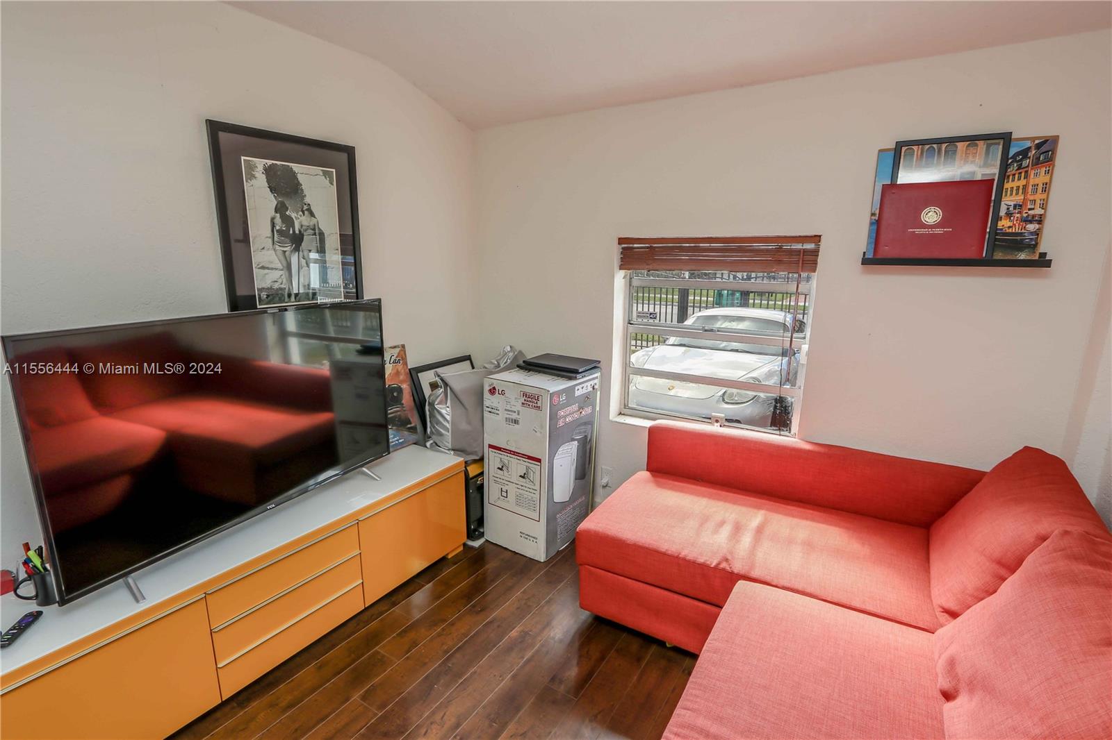 5635 Southwest 5th Terrace Miami, FL 33134 - Photo 14 of 28 a room with furniture and a flat screen tv