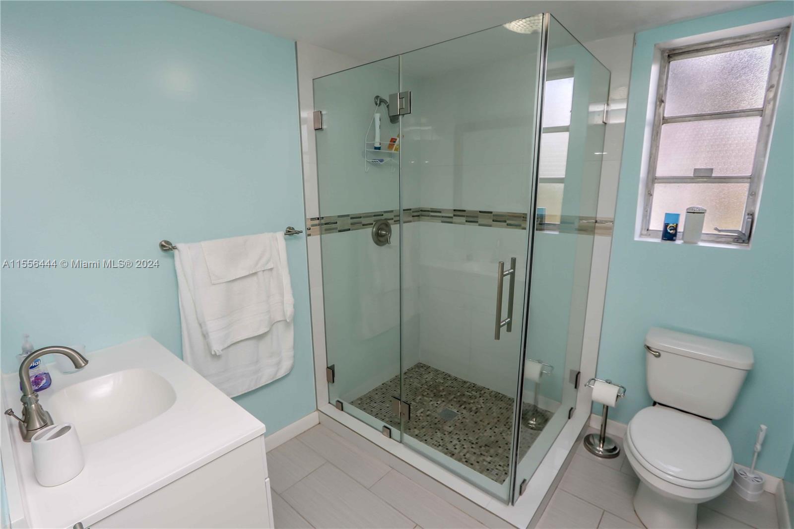 5635 Southwest 5th Terrace Miami, FL 33134 - Photo 16 of 28 a bathroom with a sink toilet and shower