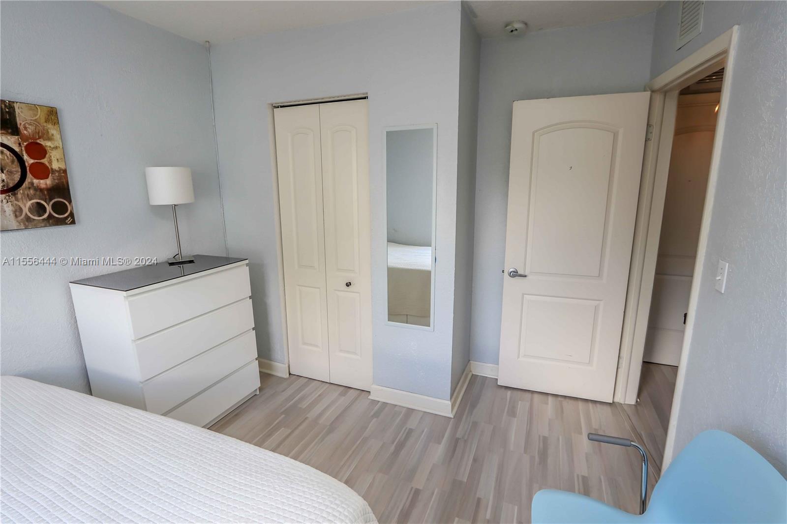 5635 Southwest 5th Terrace Miami, FL 33134 - Photo 19 of 28 a room with a bed and a wooden floor
