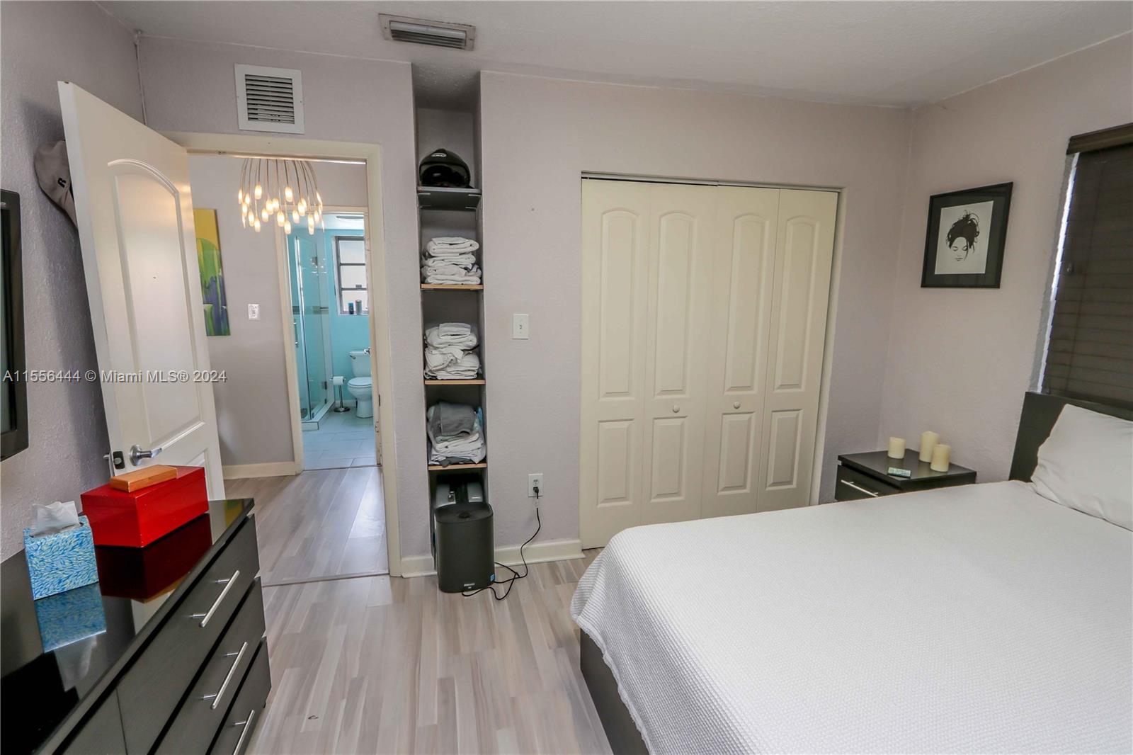 5635 Southwest 5th Terrace Miami, FL 33134 - Photo 21 of 28 a bedroom with a bed and wooden floor