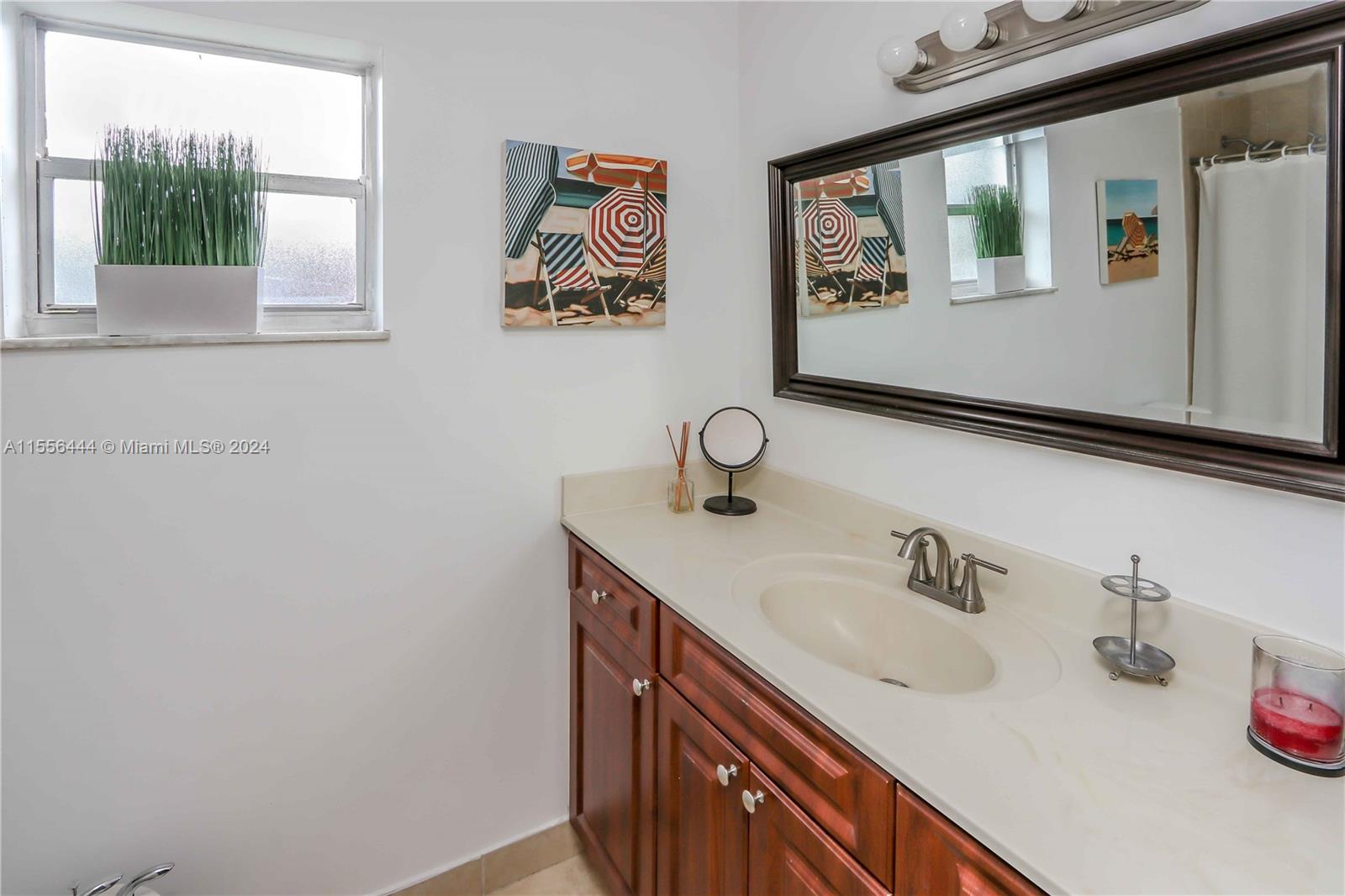 5635 Southwest 5th Terrace Miami, FL 33134 - Photo 22 of 28 a bathroom with a sink and a mirror
