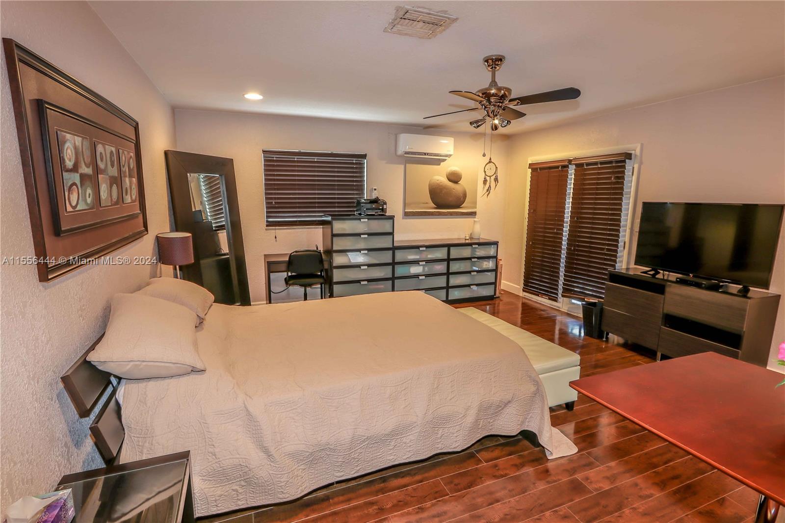 5635 Southwest 5th Terrace Miami, FL 33134 - Photo 23 of 28 a bedroom with a bed and a flat screen tv
