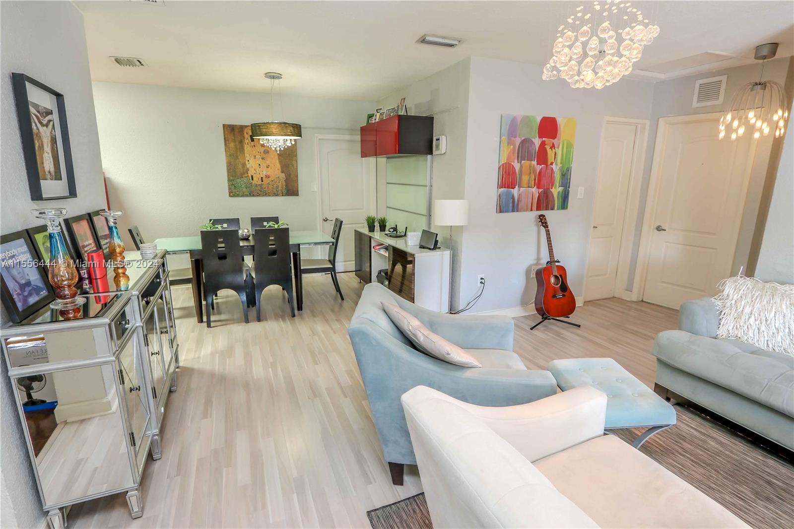 5635 Southwest 5th Terrace Miami, FL 33134 - Photo 7 of 28 a living room with furniture and a flat screen tv