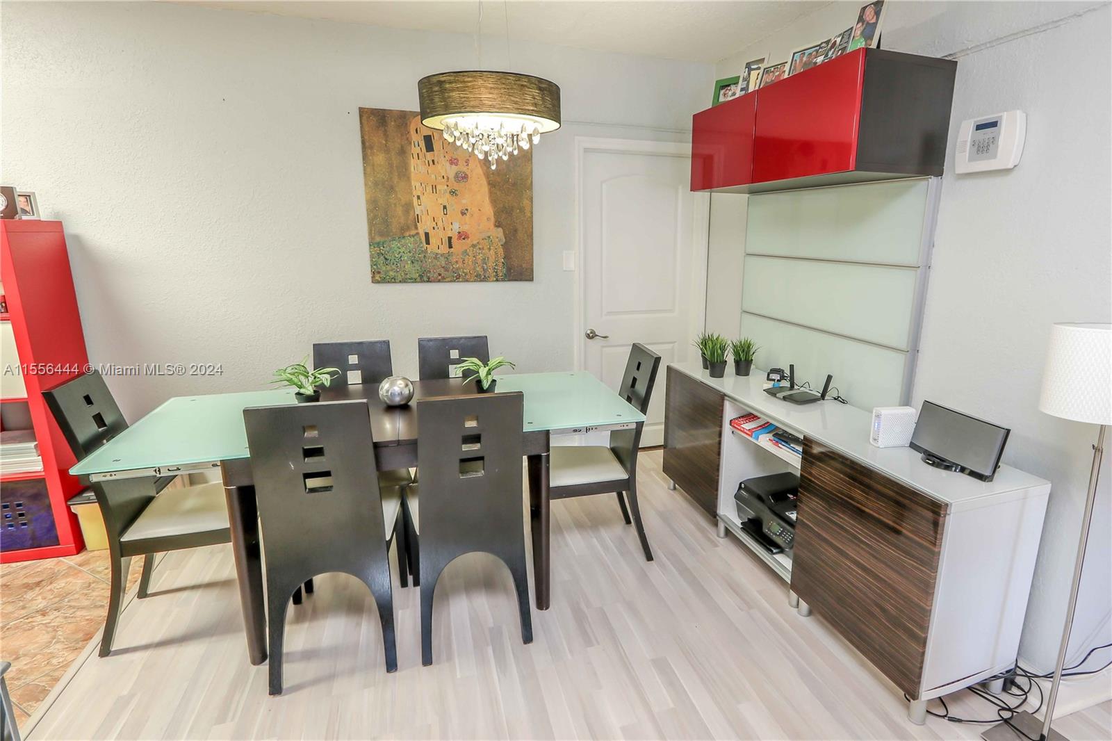 5635 Southwest 5th Terrace Miami, FL 33134 - Photo 8 of 28 a view of a dining room with furniture and wooden floor
