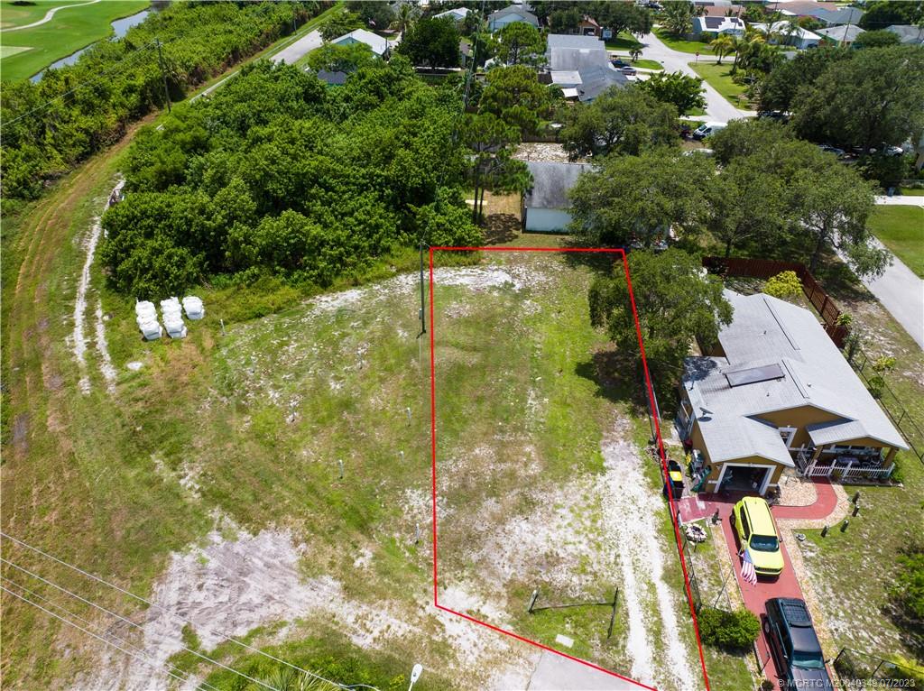 Tbd Southeast Primrose Way Stuart, FL 34997 - Photo 2 of 7 an aerial view of residential houses with outdoor space