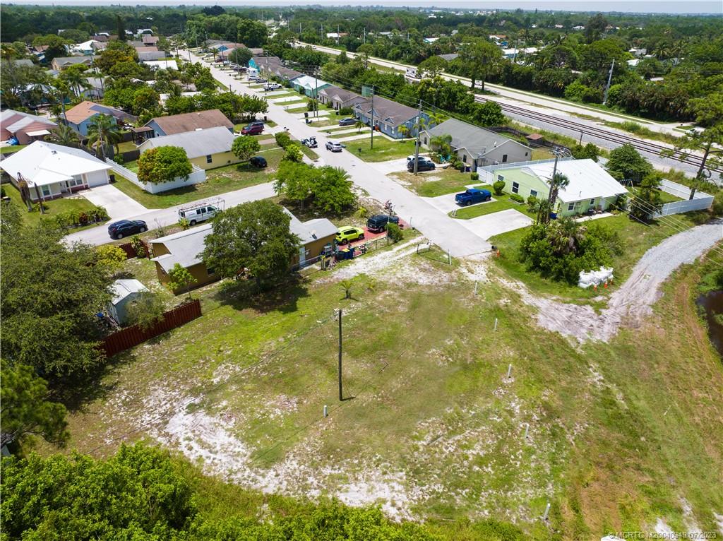 Tbd Southeast Primrose Way Stuart, FL 34997 - Photo 6 of 7 a view of a houses with yard