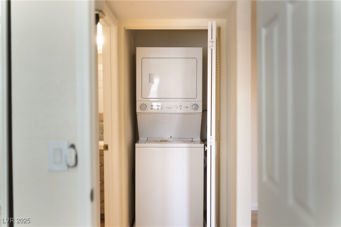 3318 North Decatur Boulevard, Unit 2143 Las Vegas, NV 89130 - Photo 18 of 34 Laundry room featuring stacked washing machine and dryer