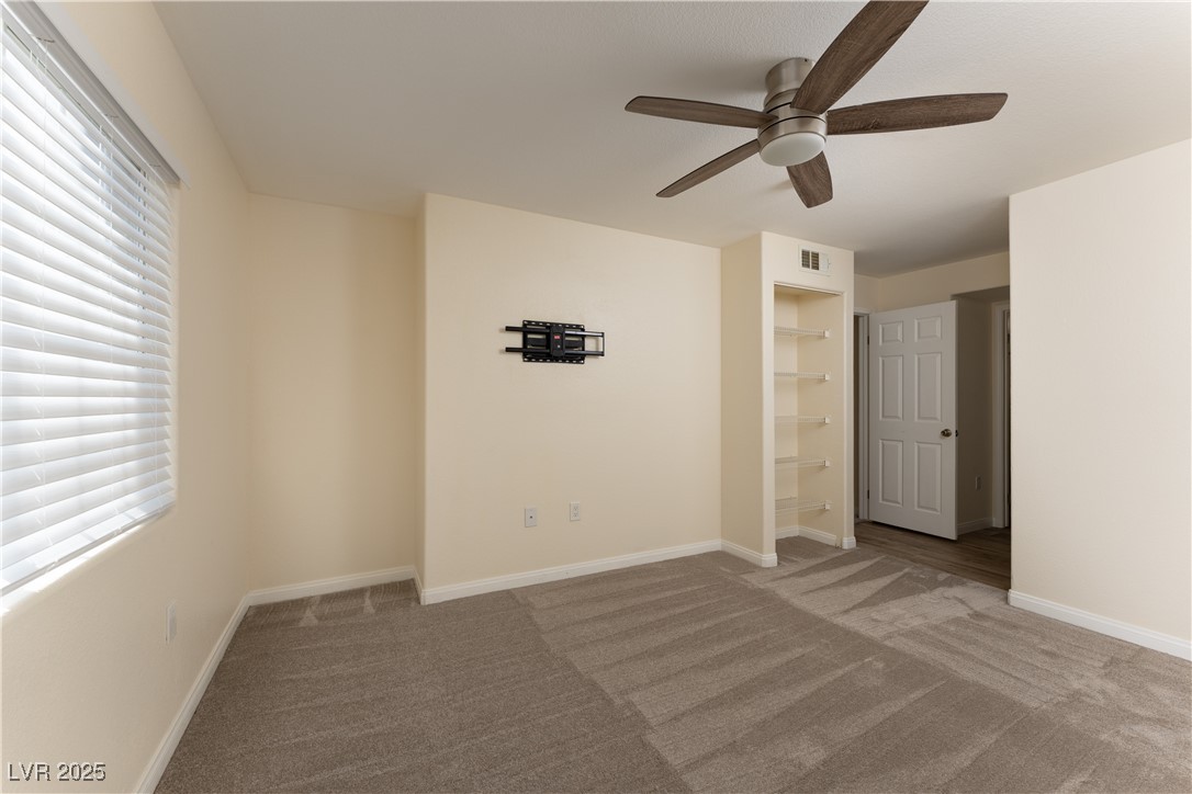 3318 North Decatur Boulevard, Unit 2143 Las Vegas, NV 89130 - Photo 22 of 34 Unfurnished room with carpet and a ceiling fan