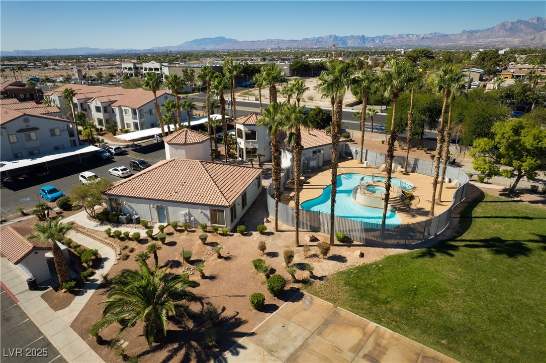 3318 North Decatur Boulevard, Unit 2143 Las Vegas, NV 89130 - Photo 31 of 34 Aerial perspective of suburban area with a mountain backdrop