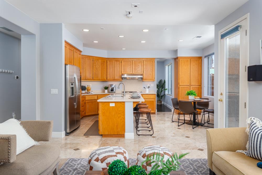 30152 Bridgeview Way Hayward, CA 94544 - Photo 12 of 37 a living room with furniture floor to ceiling window and wooden floor