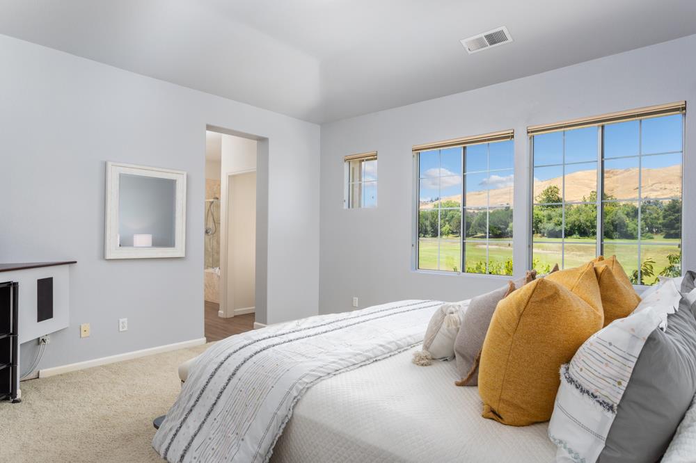 30152 Bridgeview Way Hayward, CA 94544 - Photo 23 of 37 a bedroom with a bed and large windows