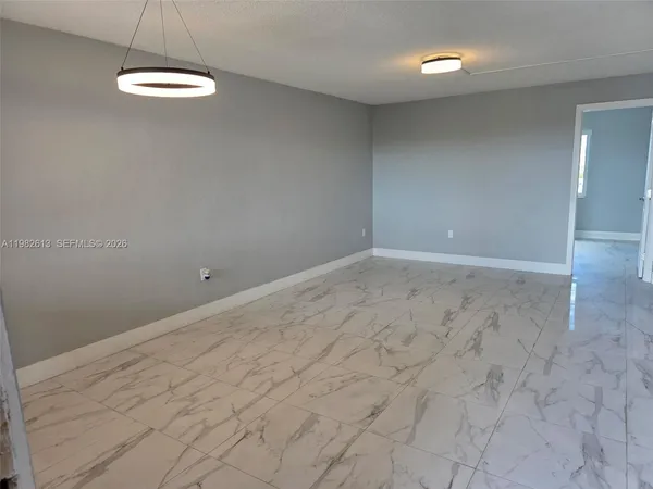 en empty room with windows