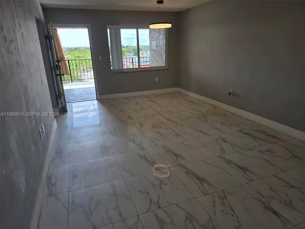 a kitchen with a stove and a microwave