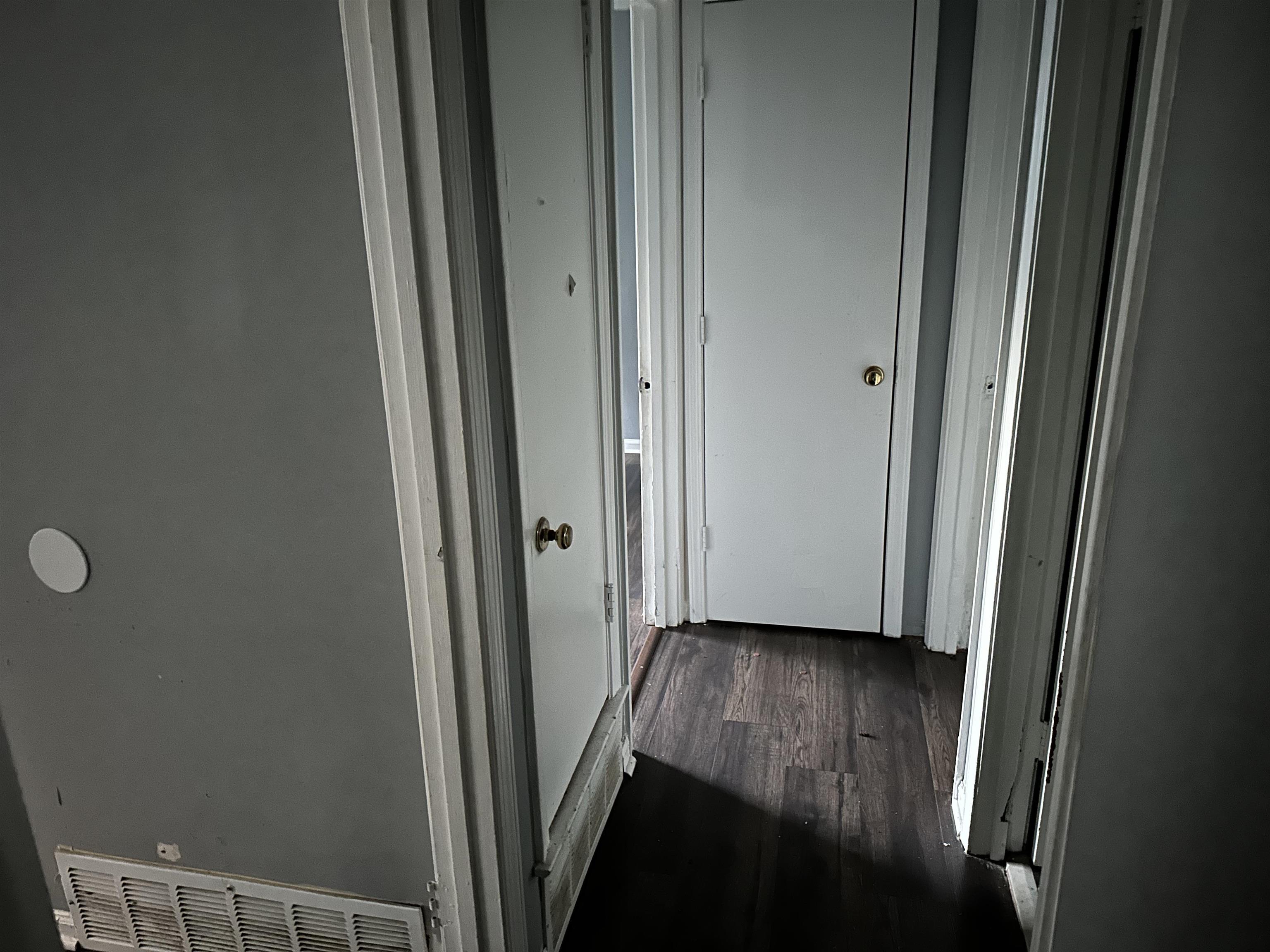 4850 Applestone Street Memphis, TN 38109 - Photo 4 of 9 a view of a hallway with wooden floor