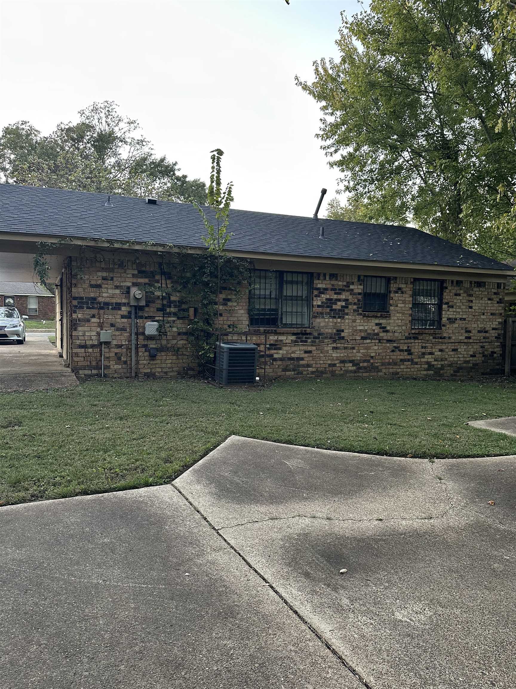 4850 Applestone Street Memphis, TN 38109 - Photo 7 of 9 front view of a house with a yard