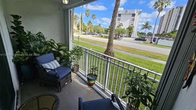 a view of balcony with a potted plant