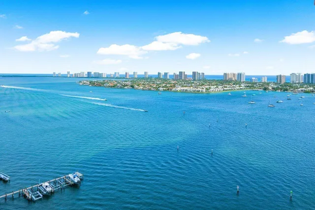 a park view with a bench and tables