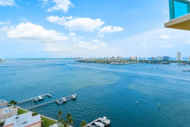 a view of a patio with a table and chairs under an umbrella