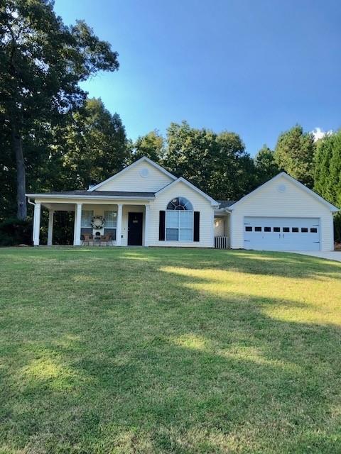 604 Raleigh Court Winder, GA 30680 - Photo 1 of 1 a view of a house with a yard
