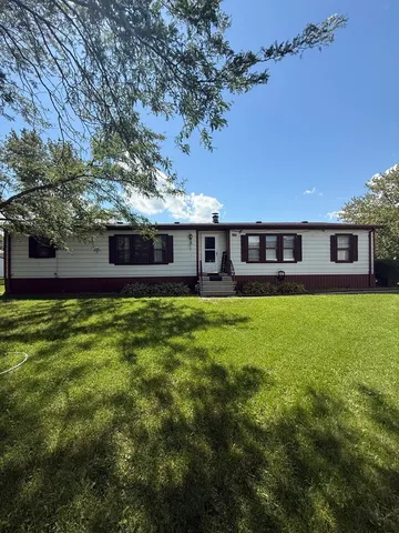 front view of a house with a big yard