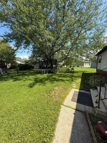 a view of a park with large trees