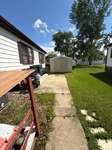 a view of backyard with swimming pool