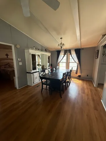 a view of a livingroom with furniture and wooden floor