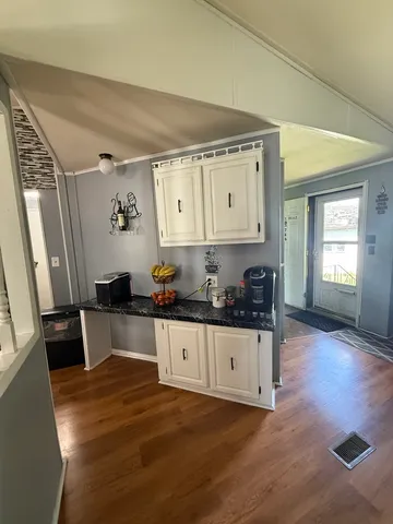 a kitchen with stainless steel appliances a stove a sink and a refrigerator