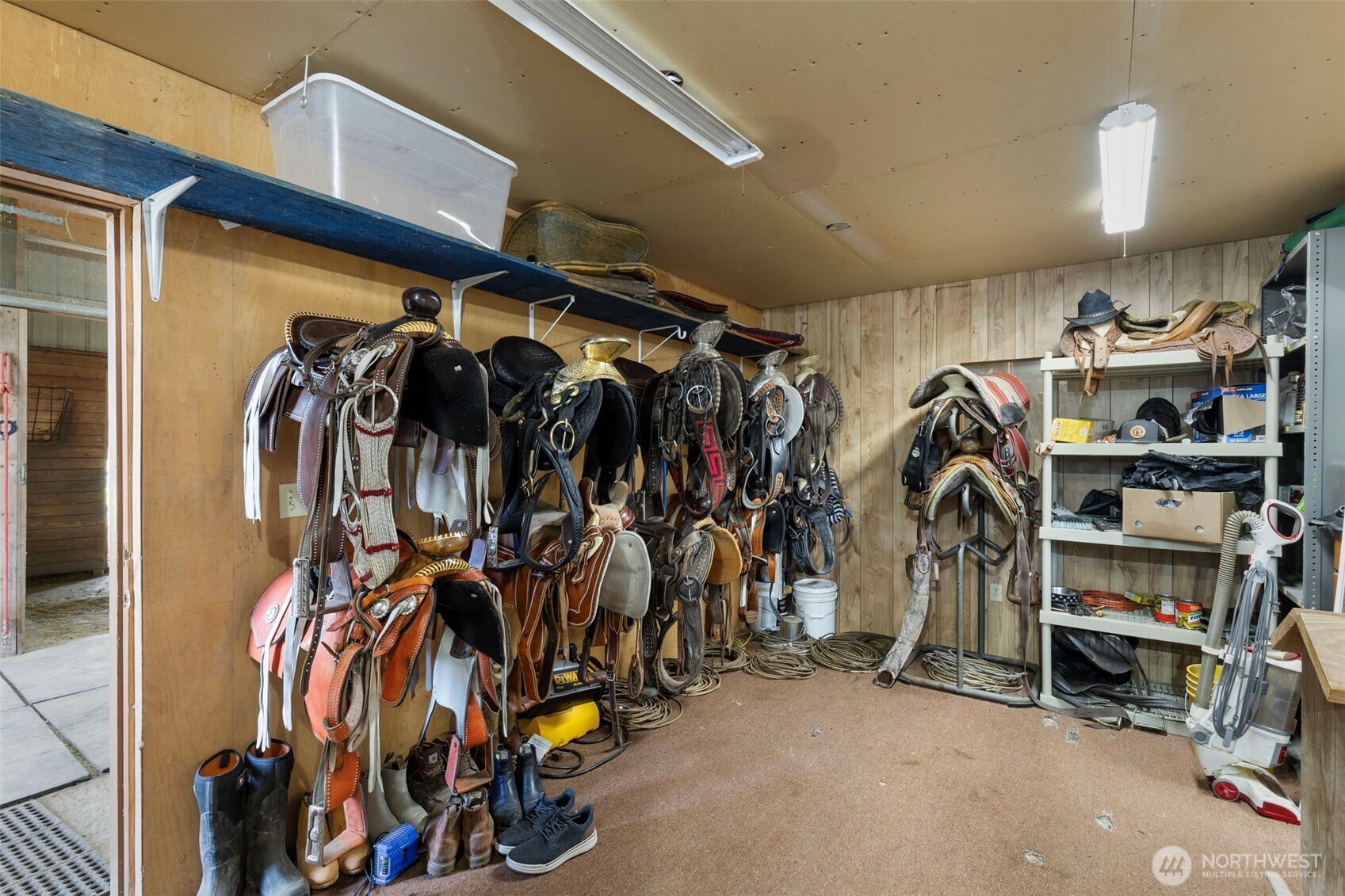 14110 Glenwood Road Southwest Port Orchard, WA 98367 - Photo 32 of 40 a view of walk in closet with clothes and shoes