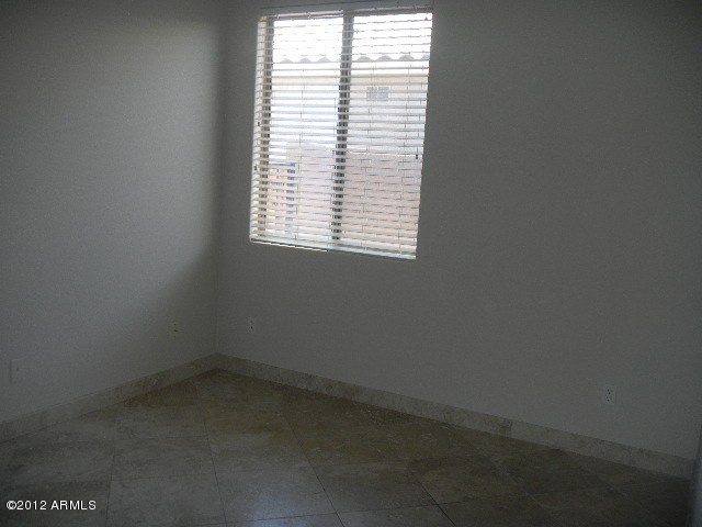 844 South Roca Court Gilbert, AZ 85296 - Photo 6 of 14 an empty room with a window