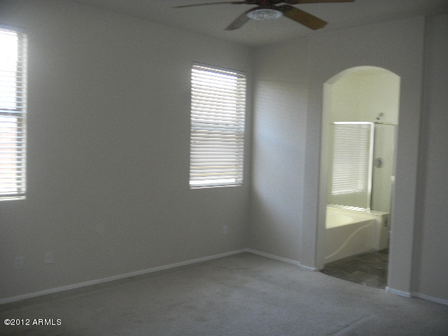 844 South Roca Court Gilbert, AZ 85296 - Photo 7 of 14 an empty room with a window