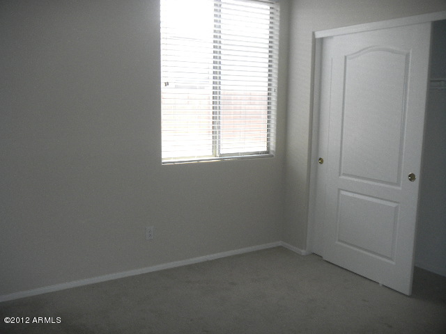 844 South Roca Court Gilbert, AZ 85296 - Photo 8 of 14 an empty room with a window