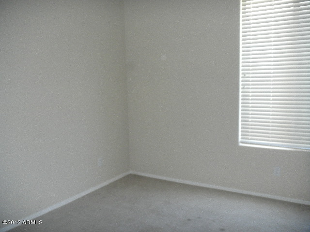 844 South Roca Court Gilbert, AZ 85296 - Photo 9 of 14 a view of an empty room and a window