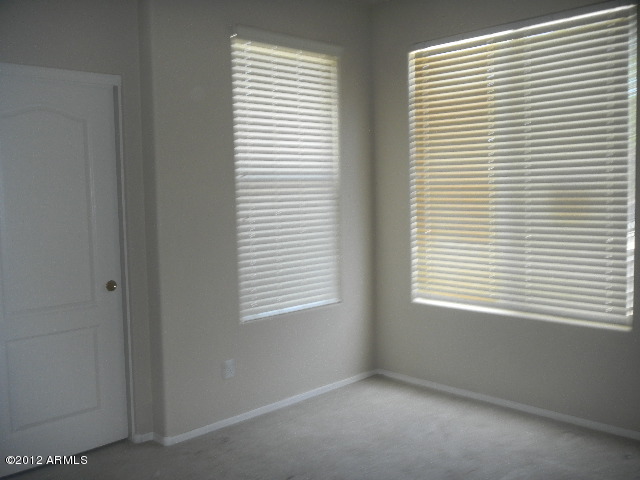 844 South Roca Court Gilbert, AZ 85296 - Photo 10 of 14 a view of an empty room with a window