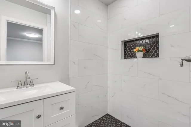 a bathroom with a sink a vanity and a mirror
