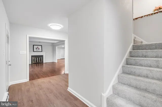 a view of staircase with white walls