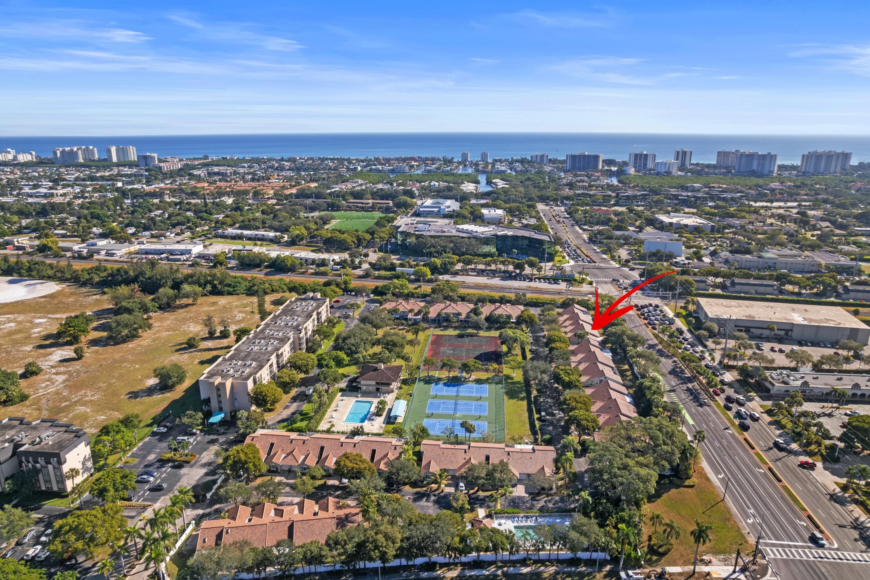 5140 Sabal Gardens Lane, Unit 2 Boca Raton, FL 33487 - Photo 1 of 34 an aerial view of a city
