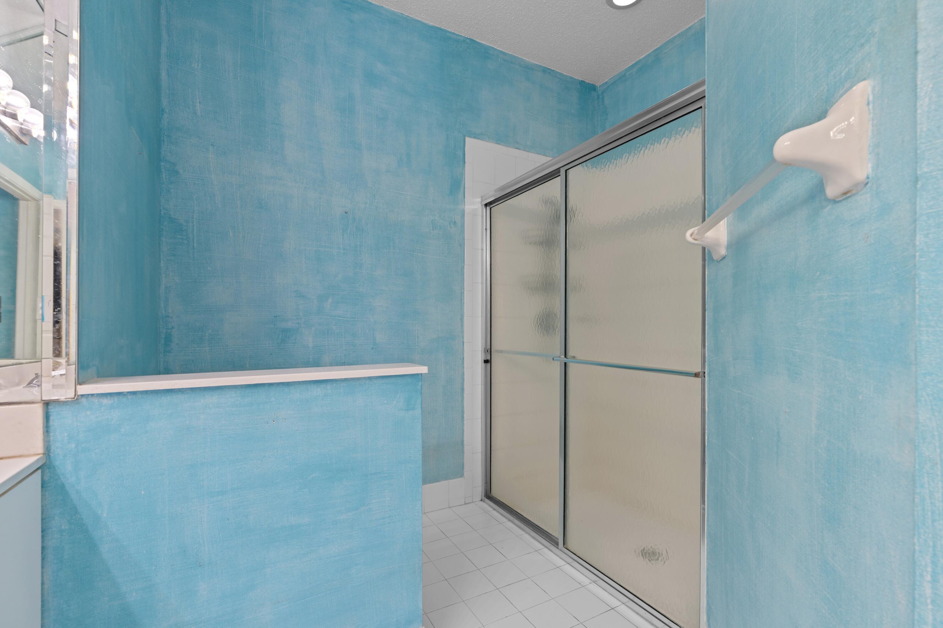 5140 Sabal Gardens Lane, Unit 2 Boca Raton, FL 33487 - Photo 11 of 34 a bathroom with a shower