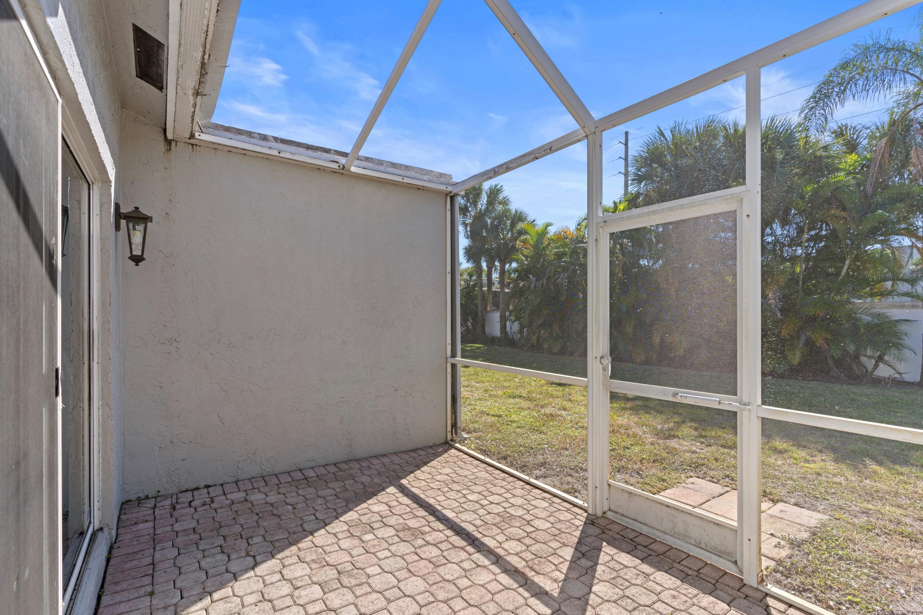 5140 Sabal Gardens Lane, Unit 2 Boca Raton, FL 33487 - Photo 14 of 34 a view of a bathroom with a glass door