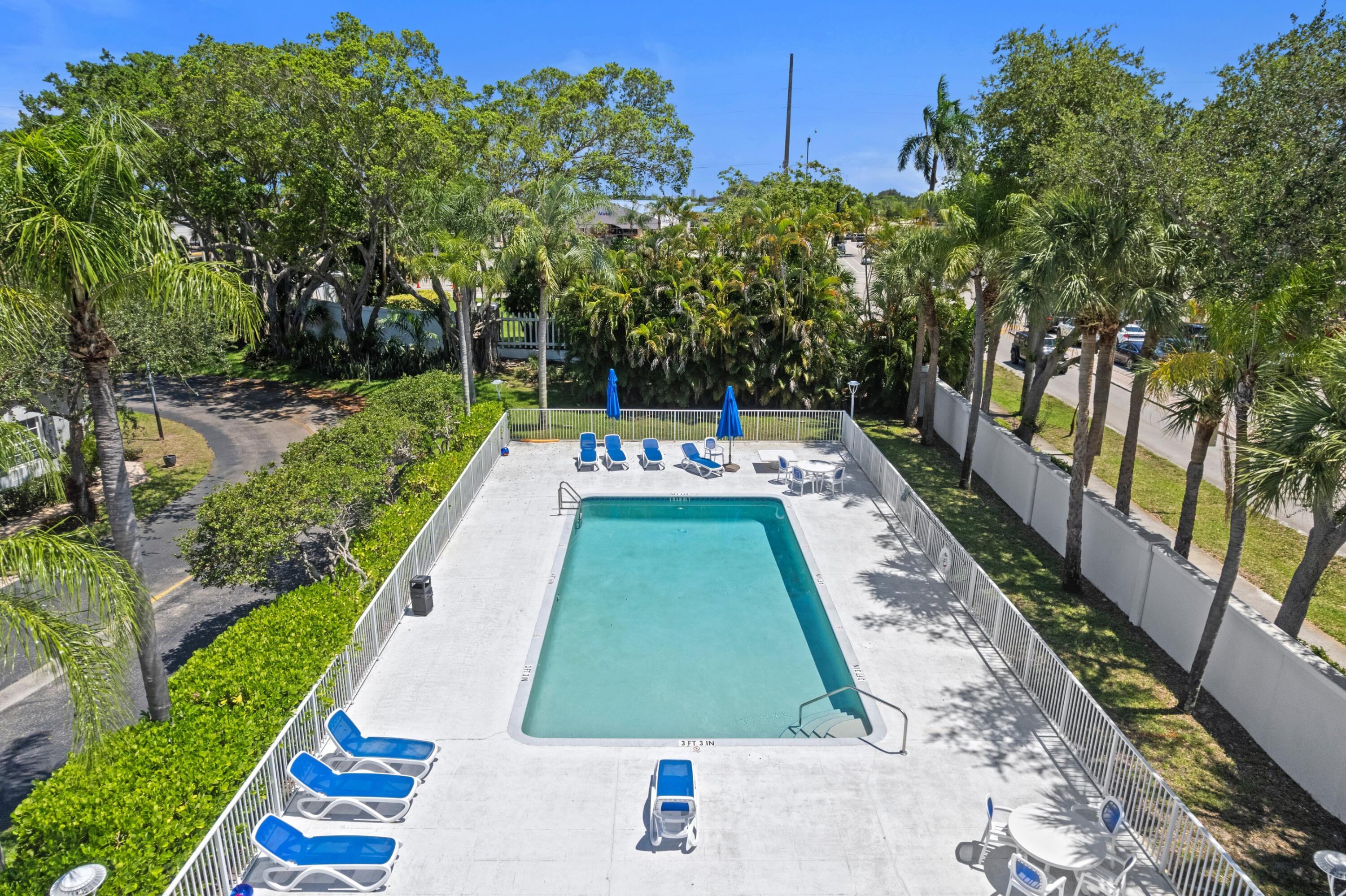 5140 Sabal Gardens Lane, Unit 2 Boca Raton, FL 33487 - Photo 19 of 34 a view of swimming pool with sitting area