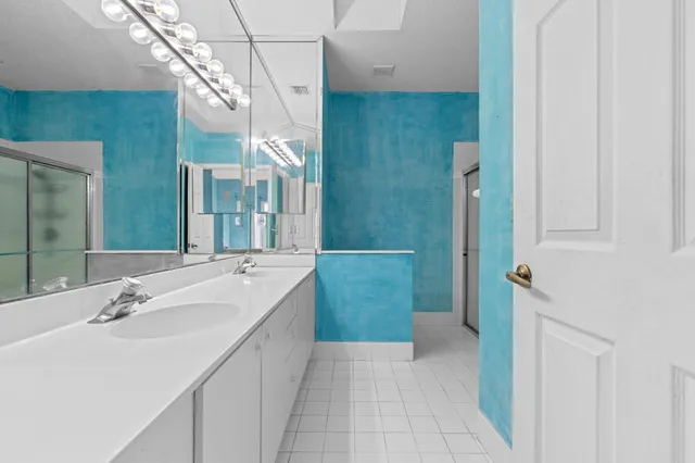 a bathroom with a sink and mirror