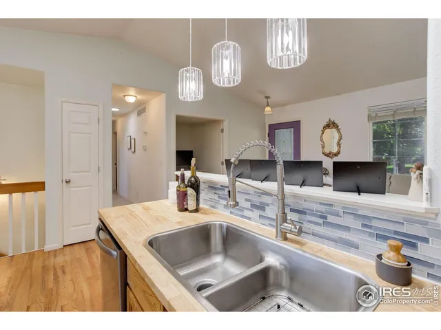 a kitchen with a sink and a refrigerator