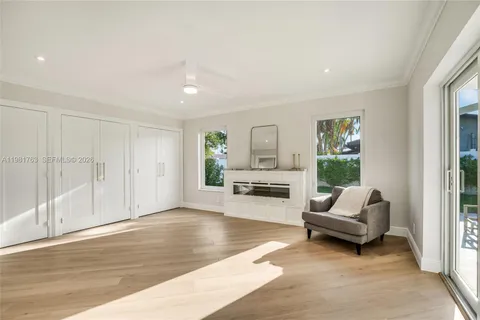 an aerial view of a house with garden space and street view