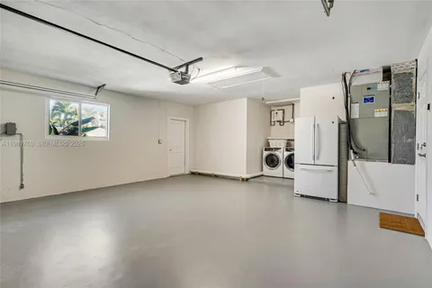 an aerial view of a house with garden space and street view