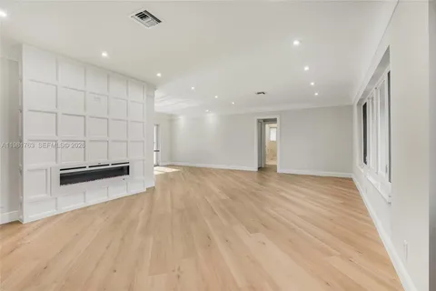 a view of a kitchen with wooden floor
