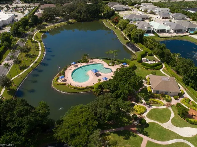 an aerial view of a house with a lake view