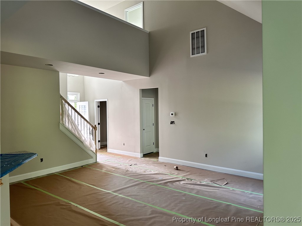 2 Collier Road Wade, NC 28395 - Photo 6 of 18 a view of a livingroom with an empty space and stairs