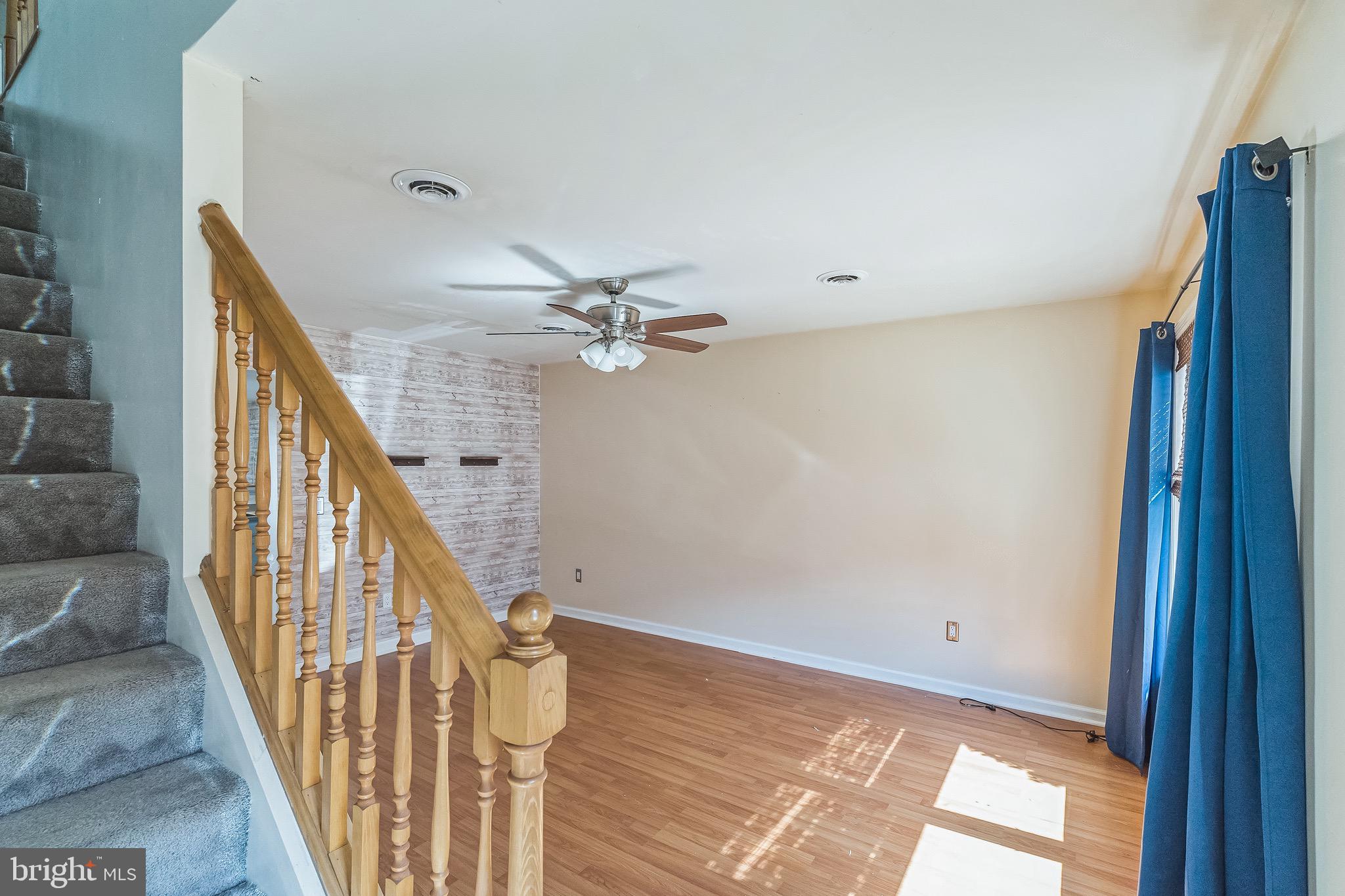 3566 Edgemont Street Philadelphia, PA 19134 - Photo 3 of 25 a view of empty room with wooden floor and fan