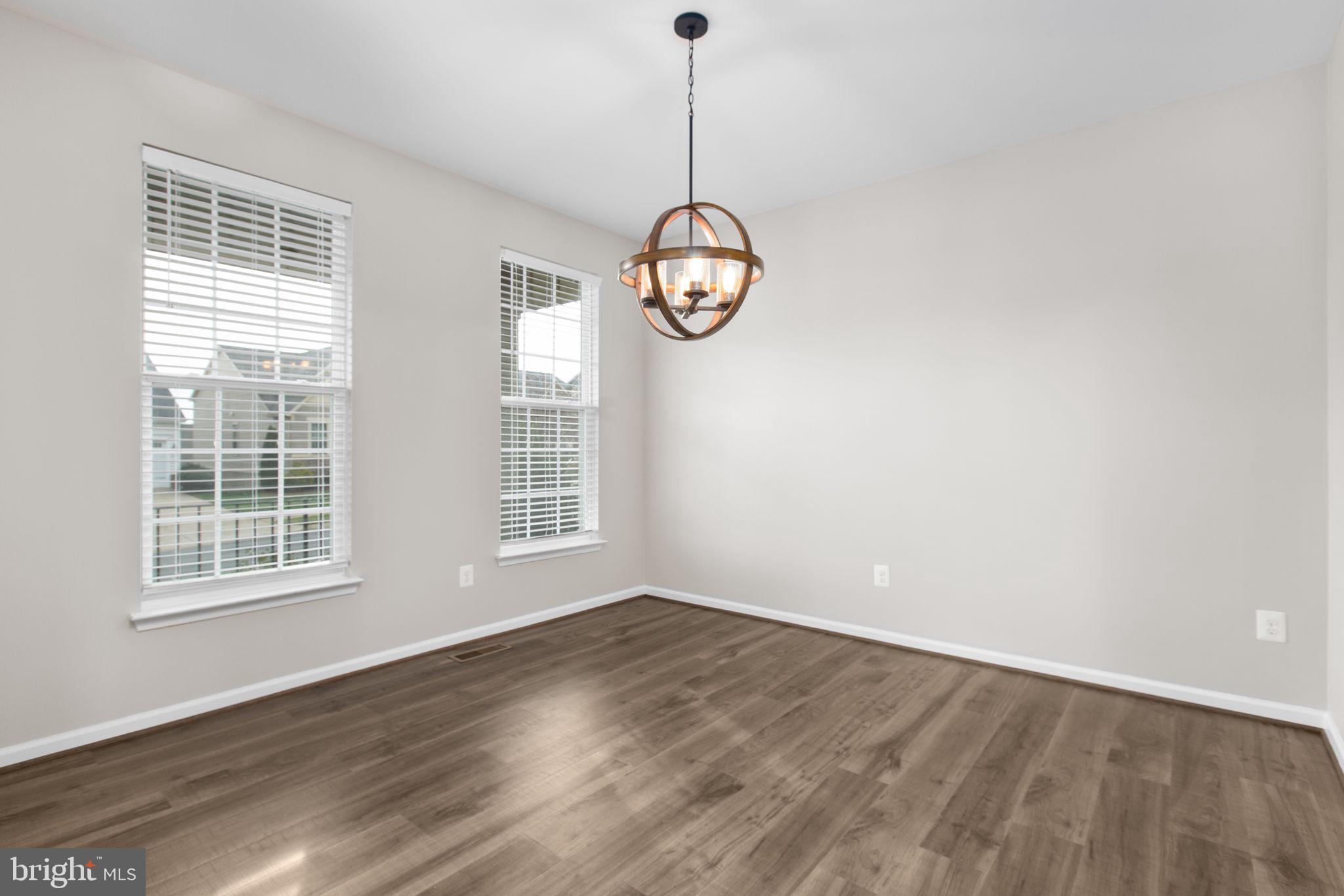 930 Forsythia Lane Stafford, VA 22554 - Photo 8 of 81 a view of a room with wooden floor and windows